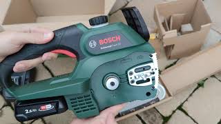 Unpacking  unboxing cordless chainsaw Bosch Universal Chain 18 06008B8000 [upl. by Ishmul57]