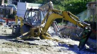 Cat 446B backhoe with hammer [upl. by Rennob]