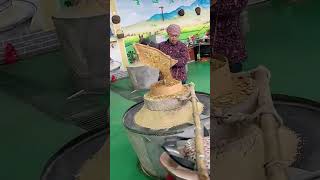 The process of grinding grains into powder with stone mills [upl. by Leima430]