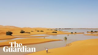 Drone footage shows rare flooding in the Sahara desert [upl. by Hersch]