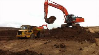 Hitachi EX350 excavator loading trucks [upl. by Leacim]