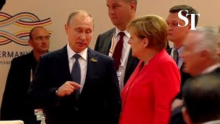 Angela Merkel gives Vladimir Putin epic eye roll [upl. by Novah]