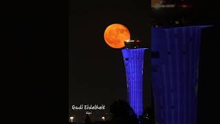 Red moon rising along TLV air traffic control tower [upl. by Iamhaj]