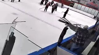 New England youth hockey coach tosses sticks onto ice after game ends [upl. by Ennaihs]