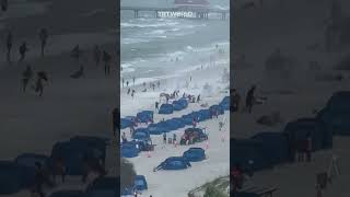 Waterspout comes ashore on a Florida beach [upl. by Nnairek]