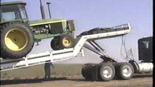 Landoll tilt bed trailer loading the tractor [upl. by Cchaddie847]