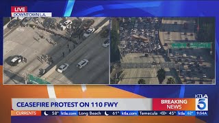 Breaking News Antiwar protesters block freeway in downtown LA [upl. by Rolanda]