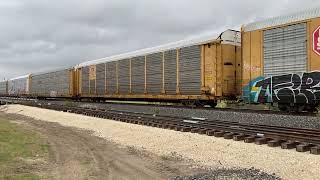 Westbound BNSF east of LaCoste TX under dark cloudy skies Auto carriers makeup this freight [upl. by Aicac42]