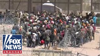 WATCH Hundreds of migrants breach razor and rush the US border [upl. by Anyah]