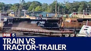 Train smashes into tractortrailer flipping it  FOX 5 News [upl. by Audris]