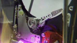 Open hard drive in a bell jar with data activity LEDs [upl. by Toshiko]