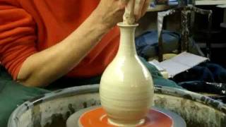 Making a simple clay pottery Olive Oil Pouring Bottle on the Wheel [upl. by Yessac]