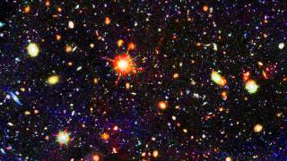 Zoom into a distant galaxy core in the Hubble GOODS North field [upl. by Airuam]