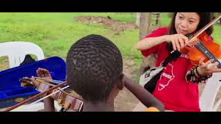 Hitomi Sakei teaching violin 🎻 at Africa Music School in Busunju Uganda 🇺🇬 [upl. by Atnoed969]