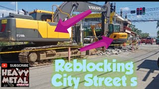 excavator  Reblocking city streets [upl. by Alyehc]