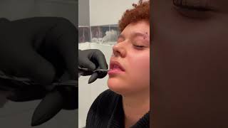 Vertical labret piercing  Underground Tattoos Enfield [upl. by Kremer421]