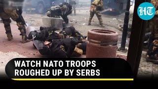 USled NATO troops chased beaten with sticks by Serbs in Kosovo  Dramatic Footage Goes Viral [upl. by Eipper]