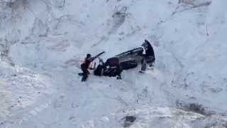 Snowmobile Hits Rider as it Rolls Down Hill  JUST SNOWMOBILES [upl. by Saimon904]