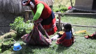 Quechua woman putting baby on her back [upl. by Isla517]