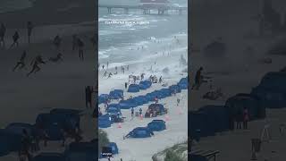 Footage captures waterspout ripping through crowded beach Shorts [upl. by Menon]