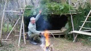 bushcraft survival long term wilderness shelter 7 of 7 heating the shelterwmv [upl. by Antonetta]