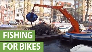 Boat crane fishes bicycle wrecks from Amsterdam canals [upl. by Jenelle212]