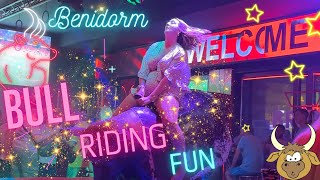 Girl in Flowers Sarafan Riding on a Bull in Benidorm 4K [upl. by Eilla354]