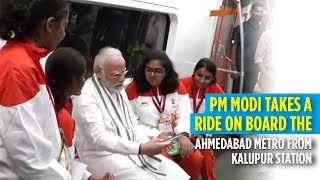 PM Modi takes a ride on board the Ahmedabad Metro from Kalupur Station [upl. by Auqinimod]