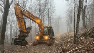 Setting up an excavator mulcher [upl. by Pihc]