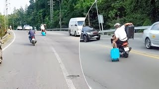 Carrying Suitcases To The Airport On Motorcycle [upl. by Elagibba]