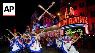 The Moulin Rouge cabaret in Paris has its windmill back after a stunning collapse [upl. by Yrtneg443]