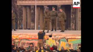 Riot Police People Trying To Look Through Small Hole In Wall Brandenburg Gate Berlin Street [upl. by O'Malley401]