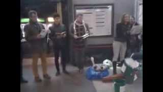 Carol singers in Bounds Green Station London [upl. by Poyssick]