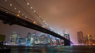 Time lapse of the Brooklyn Bridge overlooking the East River to Manhattan at night FREE STOCK VIDEO [upl. by Ocirne]