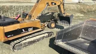 Caterpillar 385C Excavator Loading Caterpillar 773 Dumpers  Kivos Ate [upl. by Avid]