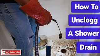 How To Snake Out A Shower Drain [upl. by Einhapets]