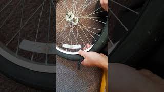 Refitting bicycle tyre onto rim Part2 cycletyre refittingtyre tyreon bicycletyre cycling [upl. by Faunie]