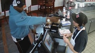 Watch Unfazed Cashier Keep His Cool During Terrifying Gunpoint Robbery [upl. by Nwahc]