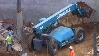 Loaders Move Dirt at Busy Construction Site [upl. by Nivrag253]