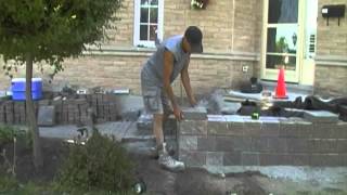 How To Build A Retaining Wall Using Unilock Pisa 2 Part 2 of 2 [upl. by Witha]