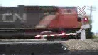 CN grain train at rural crossing [upl. by Annahsirhc]