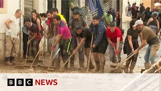 Thousands of volunteers help with clean up in floodhit Valencia  BBC News [upl. by Sabba]