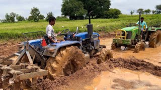 Eicher tractor stuck in mud Rescued by John Deere tractor  tractor videos [upl. by Ahsiekal]