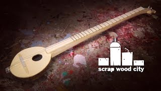 Making a 2 string musical instrument out of coconut and wood [upl. by Becker748]