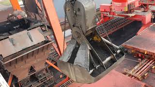 Unloading a 300 meter coal bulk ship Bucket crane with massive bucket close to the wheelhouse [upl. by Junieta]