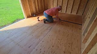 Screwing down the added plywood layer in the shed [upl. by Ehcor]