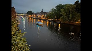 Flotilla of illuminated boats in York [upl. by Ahtanoj]