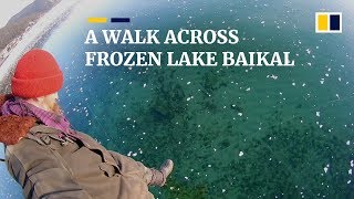 Russian man films thrilling walk across frozen ice on world’s deepest lake [upl. by Gautious]