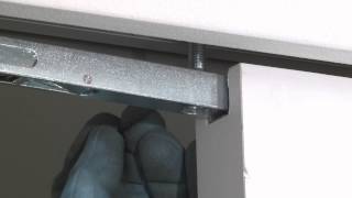 Installing the door on an Eclisse Syntesis Line pocket door system [upl. by Nosraep]