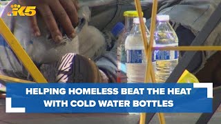 Helping homeless beat the heat by getting cold water bottles straight into their hands [upl. by Stearne]